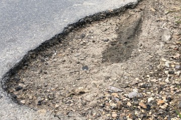 Locals’ fury as cop says potholes are good — because they ‘slow down traffic’