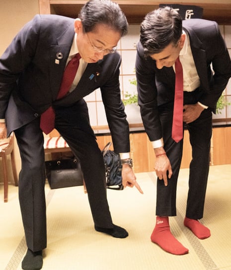 Rishi Sunak shows off his socks to the Japanese PM Fumio Kishida. His socks have the name of Kishida’s favorite baseball team, Hiroshima Toyo Carp, on them.