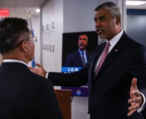 Mr. Saunders discussing his campaign with one of the guests at his reception