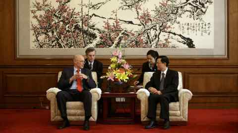 Henry Paulson, then Treasury secretary, left, meets with China’s then minister of finance Xie Xuren in 2008 in Beijing