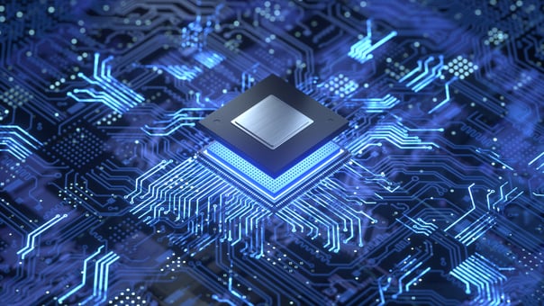 A digital rendering of a computer chip being plugged into a circuit board