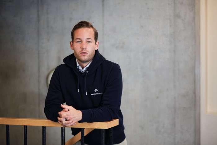 Portrait of Robin Lauder in a blue hoody, looking into the camera 