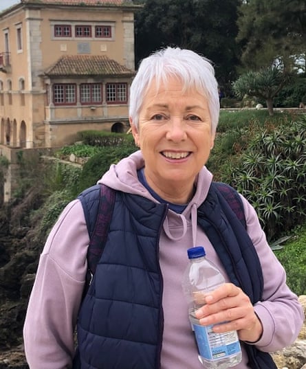 Barbara smiling outdoors in a snapshot, holding a water bottle