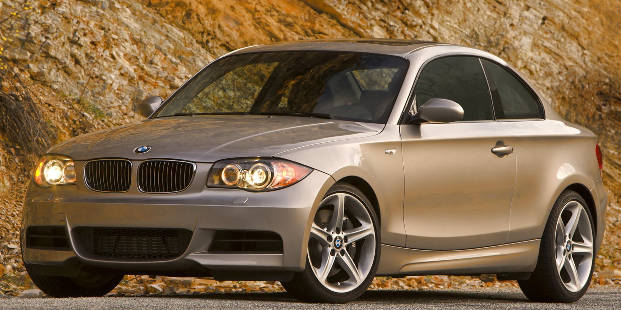 Silver BMW 135i coupe sports car parked