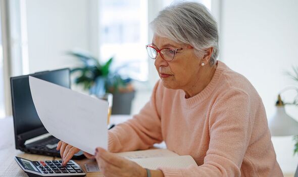 A woman checks her bills