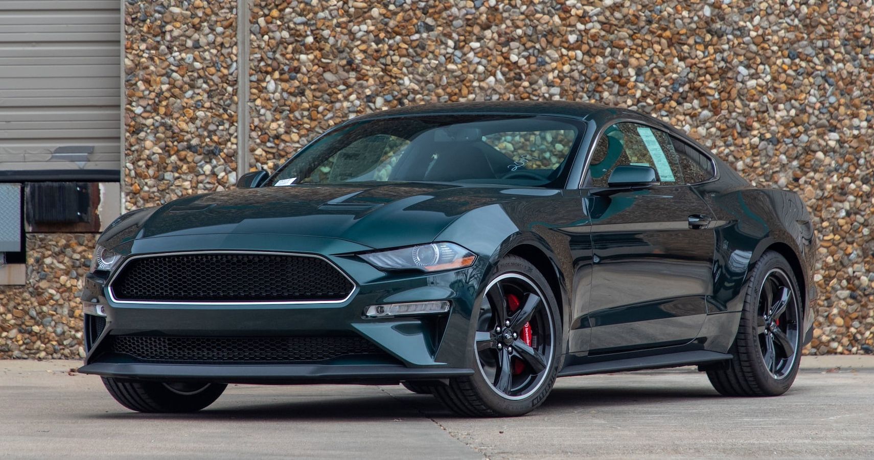 Green 2019 Ford Mustang Bullitt parked