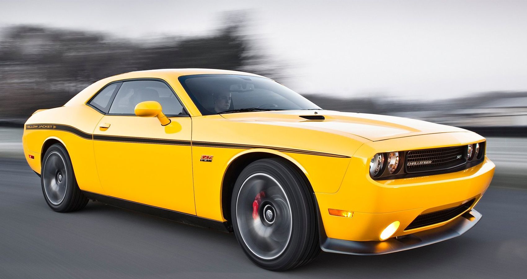 Yellow 2012 Dodge Challenger SRT8 392 on the road