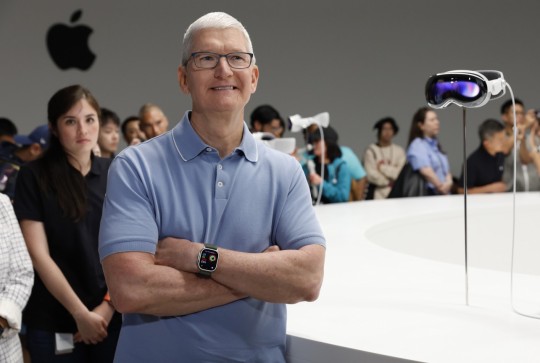 Apple CEO Tim Cook with the Vision Pro (Picture: EPA)