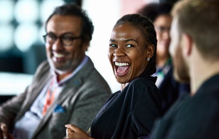 Businesspeople laughing at conferenceHappy business people laughing