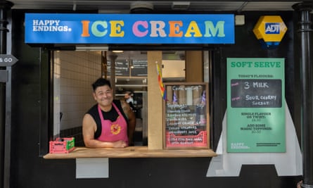 Byron Knight stands behind the counter of the Happy Endings pop-up store located in Victoria Park, London