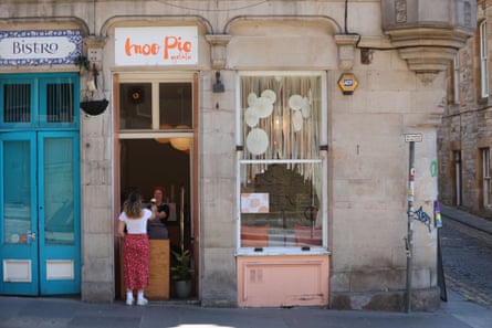 Street view of a customer being served an ice-cream at Moo Pie in Edinburgh