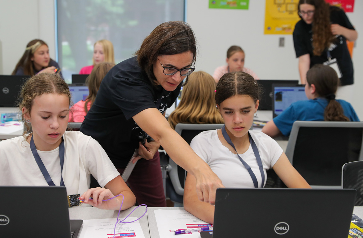 UNK associate professor Angela Hollman, center, leads an activity during the Super GenCyber Girls Camp.