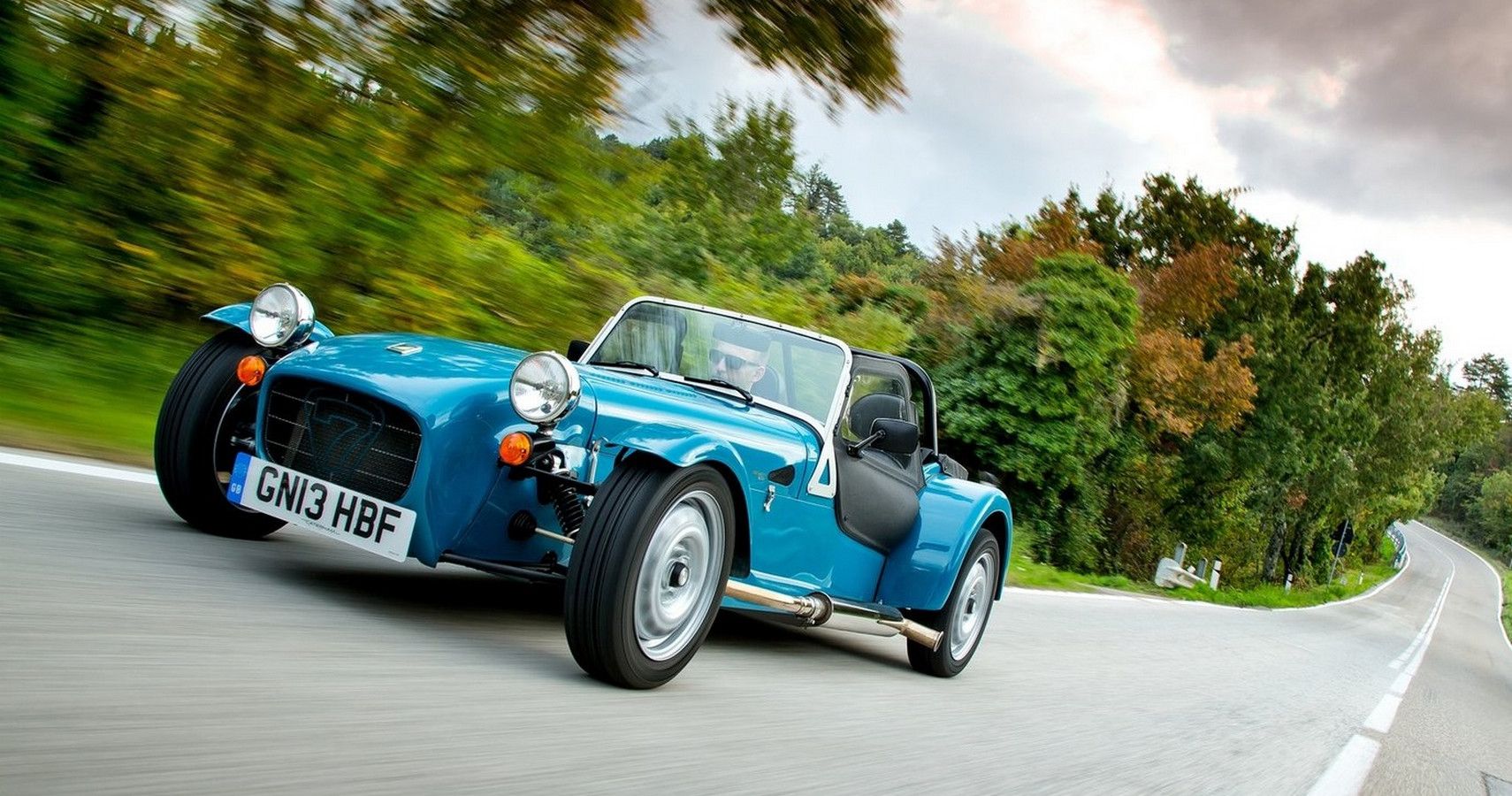 Caterham Seven blue sports car driving