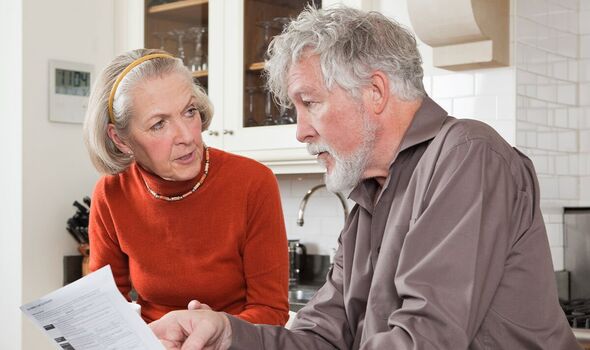 A couple check their bills