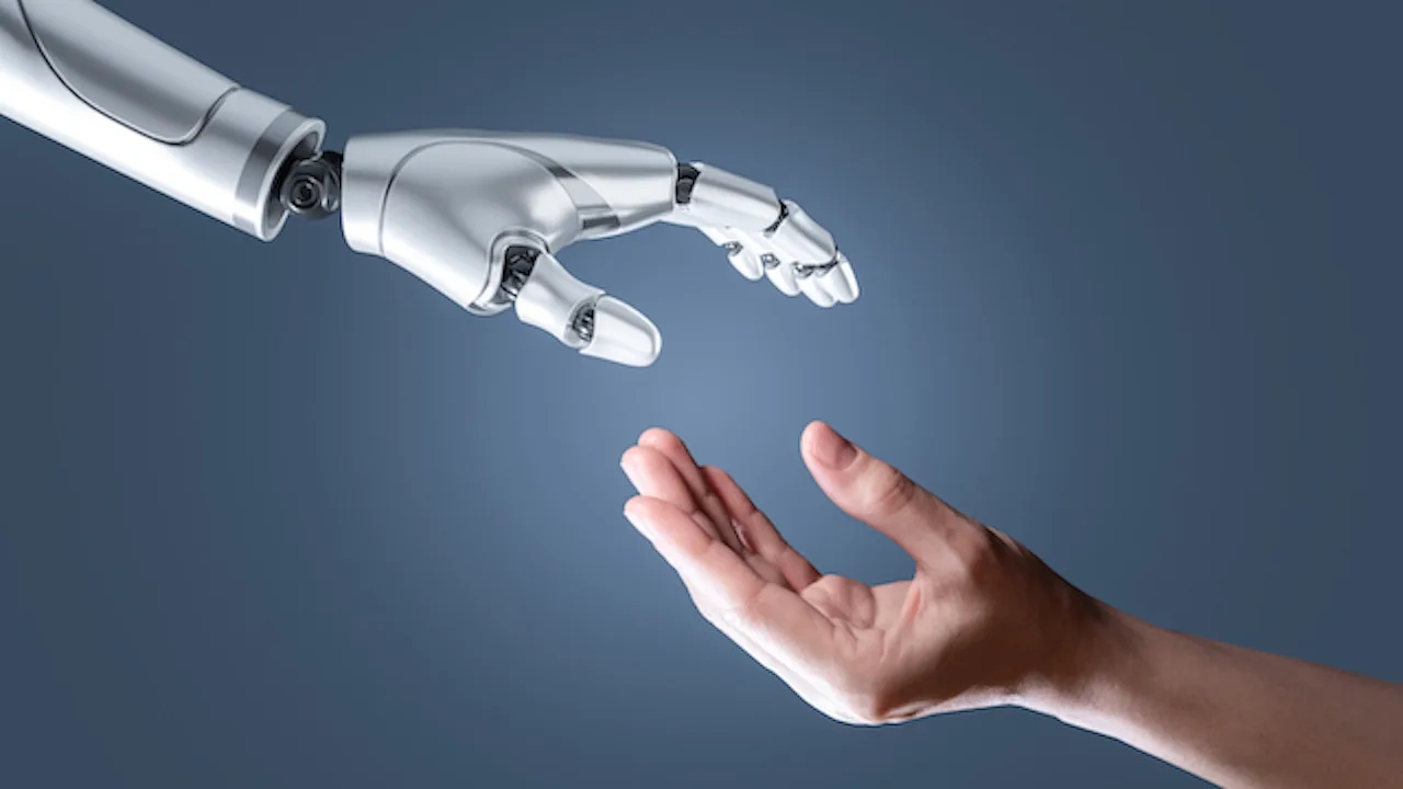 An image of Artificial intelligence robot hand and human hand