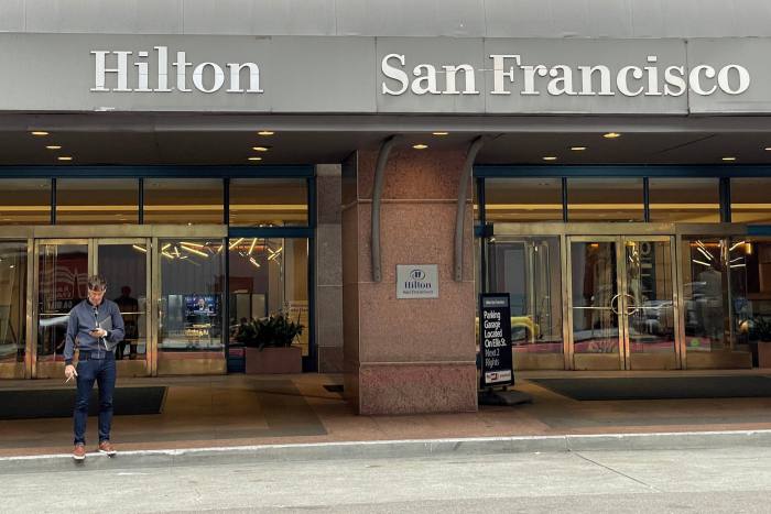 A guest stands in front of Hilton Union Square