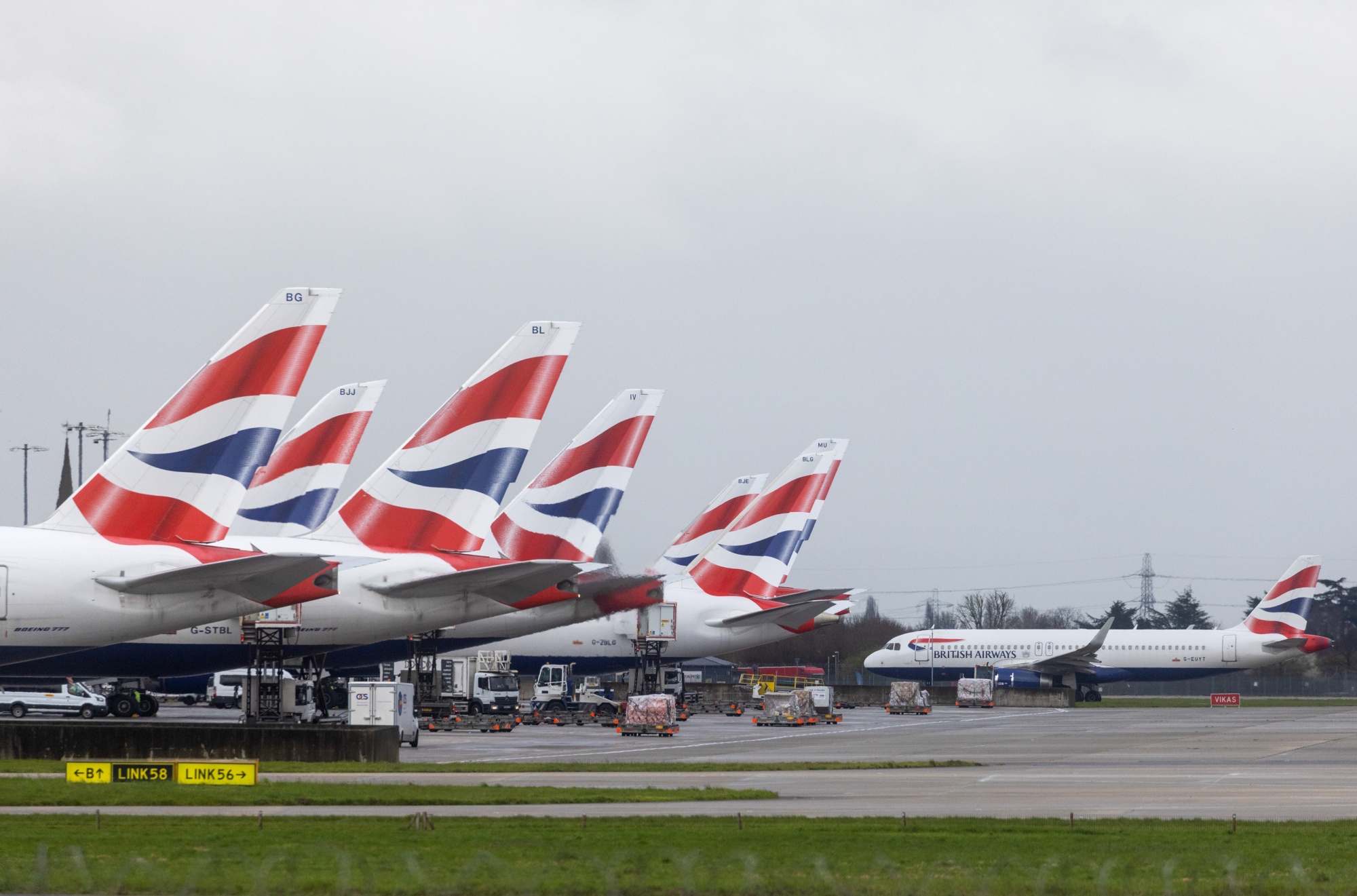 Passenger airplanes, operated by British Airways, at terminal 5 at London Heathrow Airport in London, UK, on Friday, March 31, 2023.