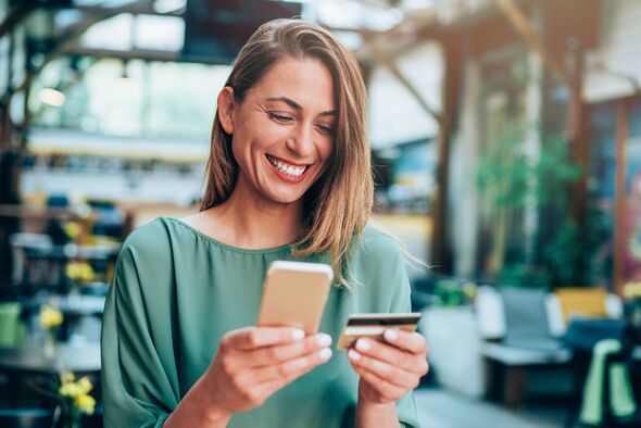 Woman smiling while online banking