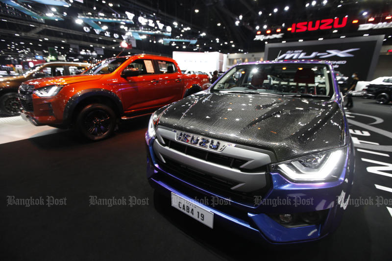 Isuzu vehicles are displayed at the Bangkok International Motor Show in March 2021. (Photo: Varuth Hirunyatheb)