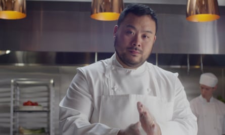 David Chang standing in a commercial kitchen in chef’s whites