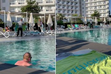 Moment hotel staff get revenge on sunbed hoggers as worker snatches towels