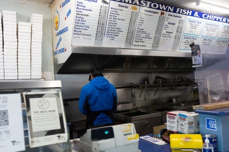 Sam Yongquan at work in his Thomastown fish and chip shop.