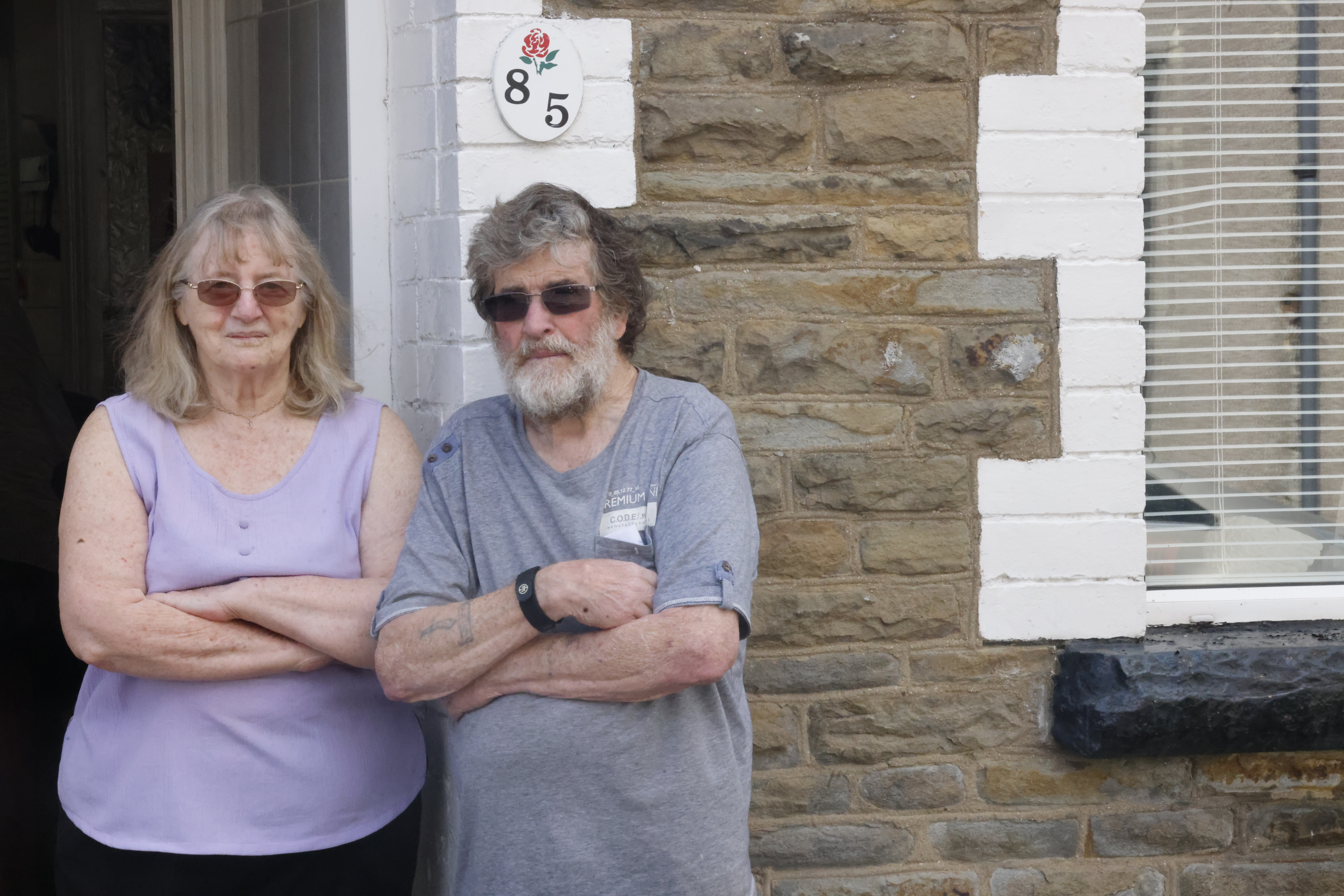 Haydn and June Yeoman were fined for parking outside their own home despite having a permit