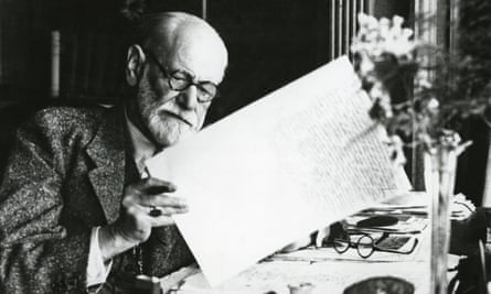 Sigmund Freud reading his notes in his office