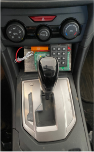 An experimental prototype of the Battery Sleuth code entry device installed in a vehicle. Image credit: Kang Shin.