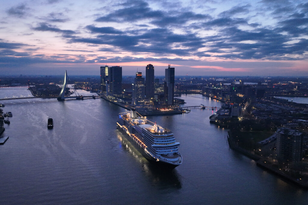 Holland America Line's Rotterdam VII arrives in Rotterdam at twilight. ,