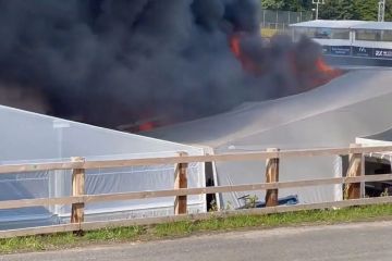 Fire erupts at UK race track as black smoke billows from paddock