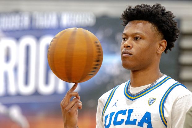 Ex-UCLA basketball player Jaylen Clark showcases his ball-handling skills Saturday,...