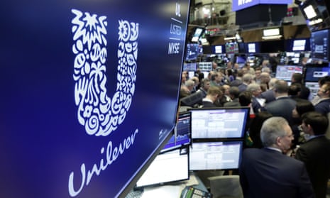 The logo for Unilever above a trading post on the floor of the New York Stock Exchange.