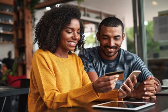 People smiling while online banking