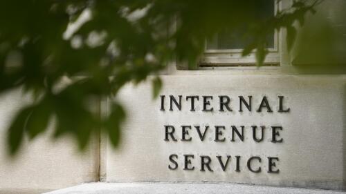 FILE - A sign is displayed outside the Internal Revenue Service building on May 4, 2021, in Washington. While Republicans seek to make good on campaign promises to cut IRS funding through the proposed debt ceiling and budget cuts package now moving through Congress, Democrats are offering assurances that the spending cuts will have little impact on the federal tax collector. (AP Photo/Patrick Semansky, File)