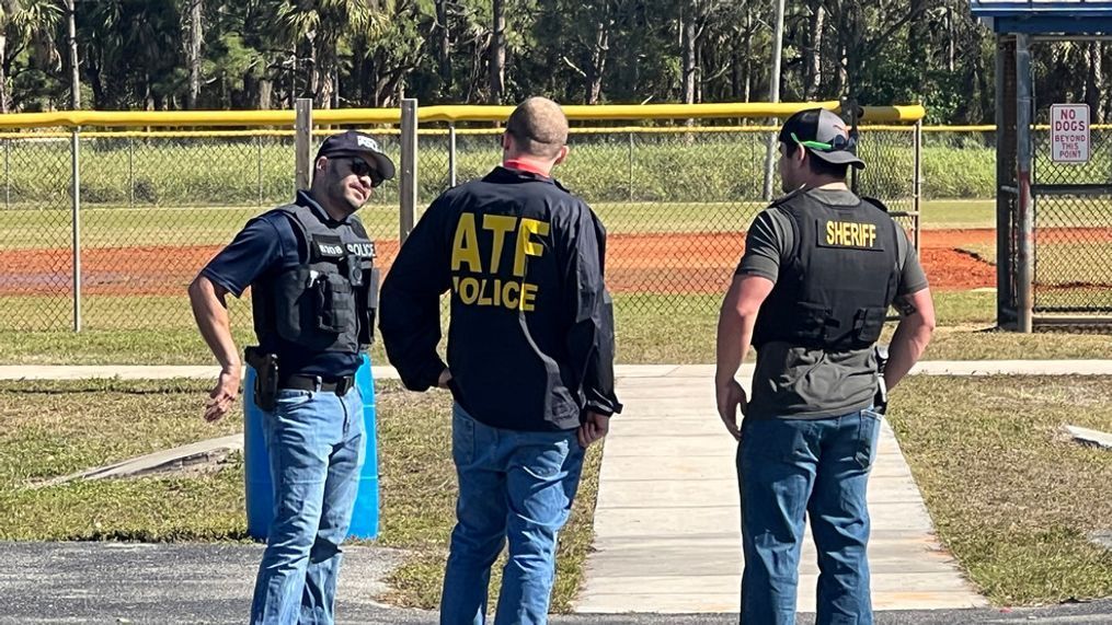 Investigators from the ATF and the St. Lucie County Sheriff's Office Crime Scene Unit at Ellis Park following MLK shooting in Fort Pierce. (WPEC){p}{/p}