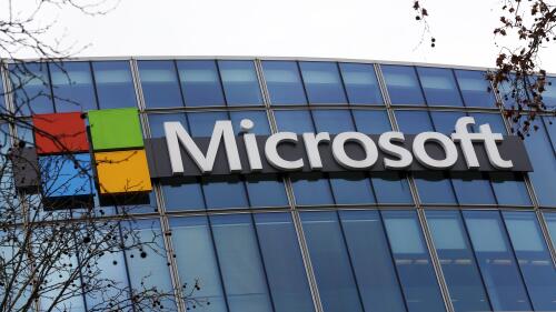 FILE - The Microsoft logo is pictured outside the headquarters in Paris, Jan. 8, 2021. British regulators have blocked Microsoft's $69 billion deal to buy videogame maker Activision Blizzard over worries that it would stifle competition in the cloud gaming market. (AP Photo/Thibault Camus, File)