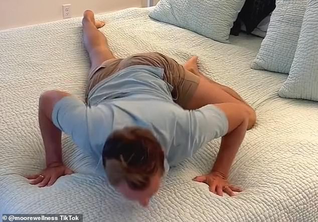 James Moore, from Kentucky in the US, demonstrated the 'thread the needle' stretch on a TikTok video viewed by nearly 13million people. Lying flat on his front, Mr Moore raises his left leg, so it is at a 90-degree angle with his right and the knee is bent