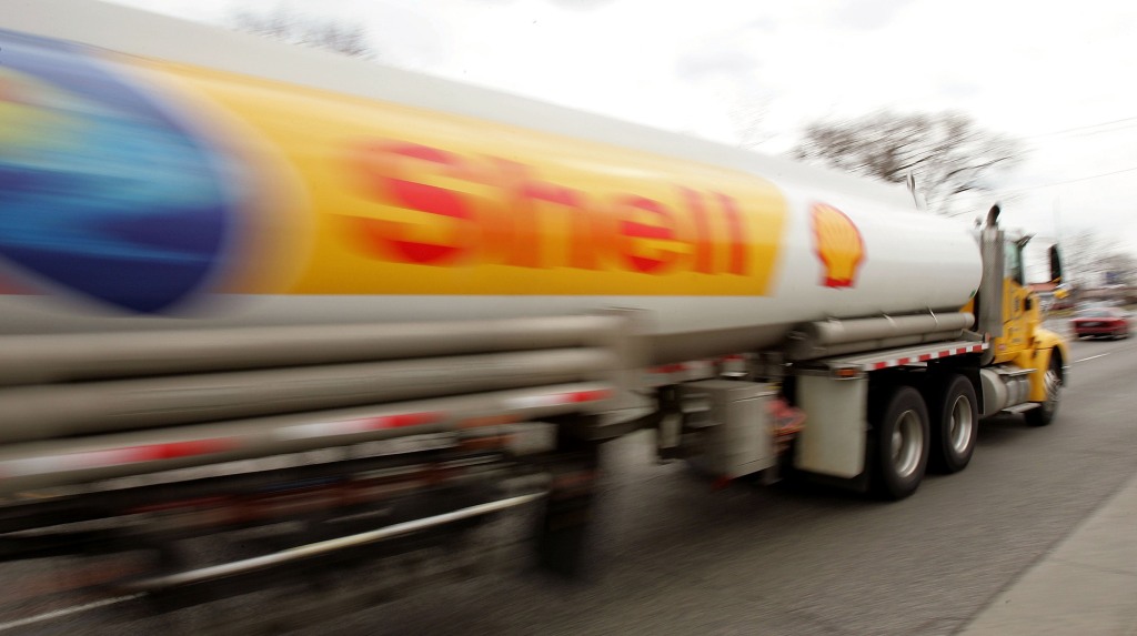 A Shell Oil tanker truck drives down a street