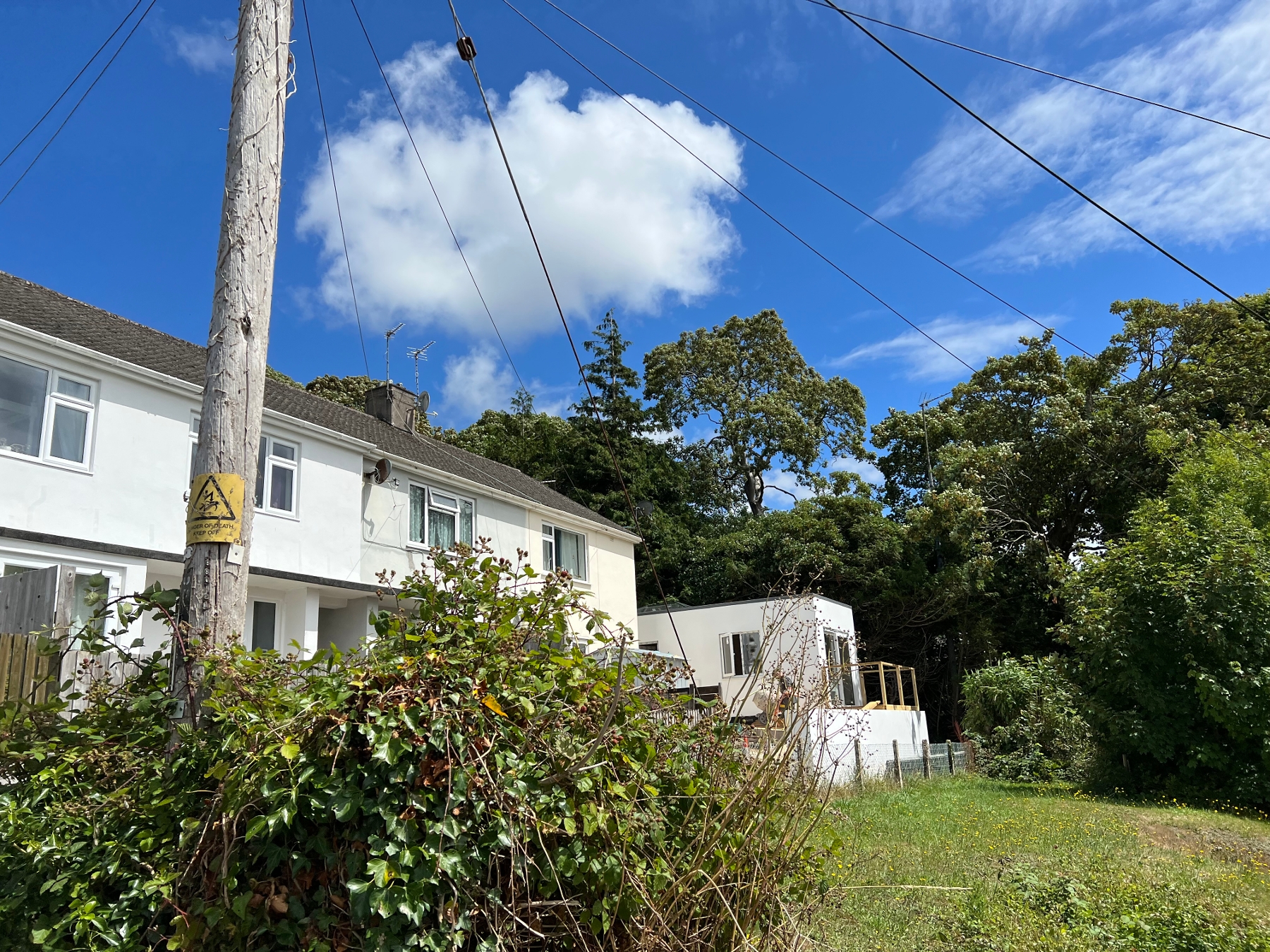 A family has accused a council of 'holding them to ransom' after being charged £20,000 by the local authority to run an electricity cable through land owned by them