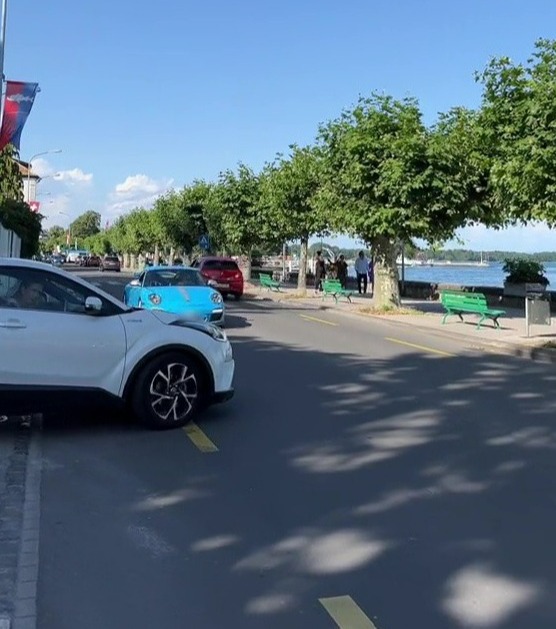 A video shows the moment a dozy Toyota driver smashes into a Porsche while pulling out at a junction - but people are divided on who's to blame