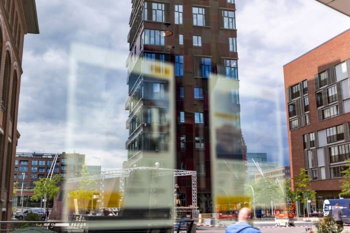 An apartment block reflected in an estate agent’s window 