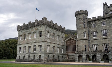 Partial view of a handsome, rugged 19th century stately home in Scottish grey stone