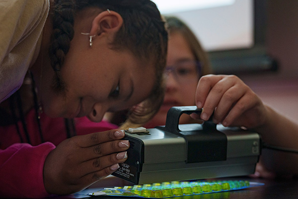 Students in the Community Science Camp analyze water samples.