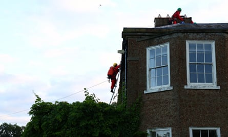 Activists climbing on to the roof of Sunak’s house.