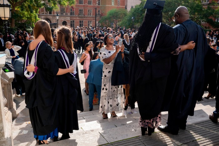 Students and their parents at a graduation ceremony 