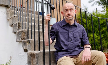 Alan Bremner sitting on a flight of outdoor steps