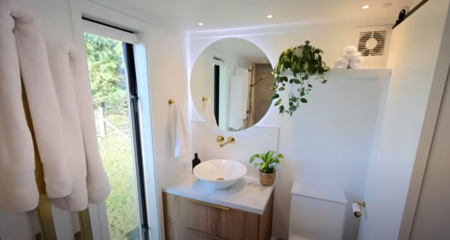 The bathroom includes a composting toilet