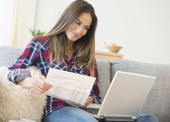 A woman checks her bills