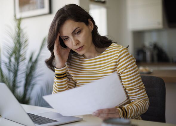 A woman checks her bills